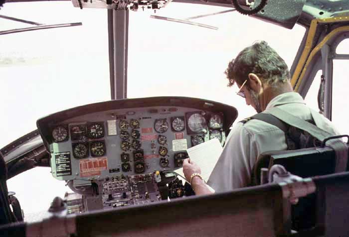 Jime Brown, pilot, pre-flight checks, Kwajalein, MI