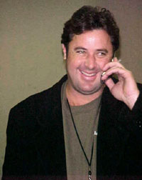 Vince Gill talking to a fan on the phone